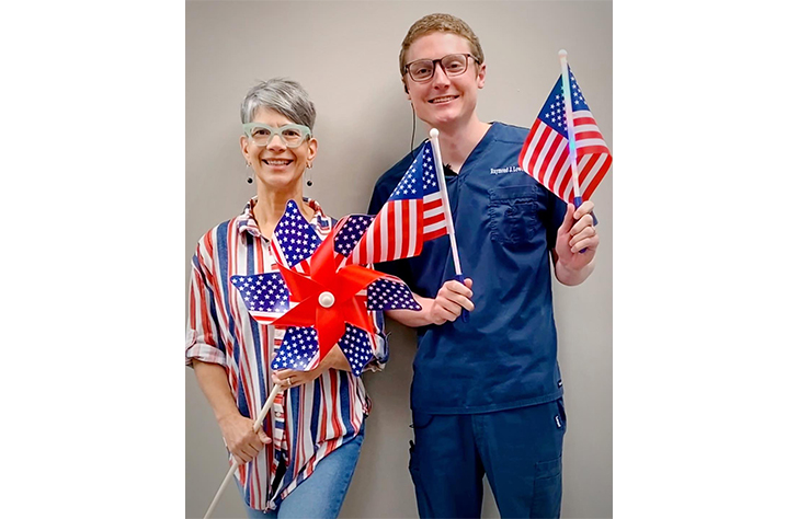 Two dentists dressed in patriotic attire