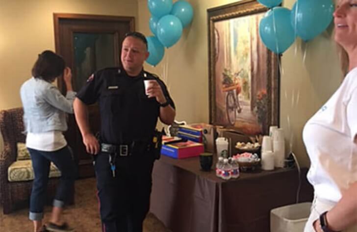 Police officer attending coffee with a cop event