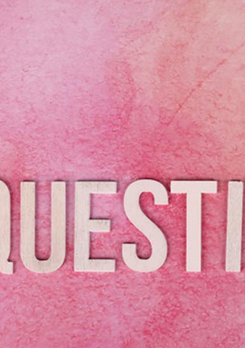 Questions spelled using wooden letters on pink background