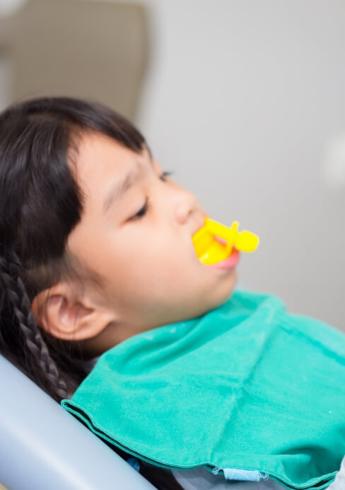 Dental patient receiving fluoride treatment