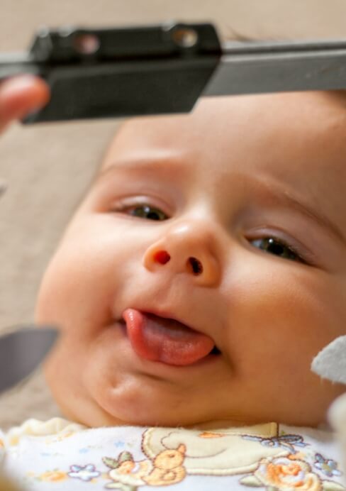 Baby smiling after frenectomy