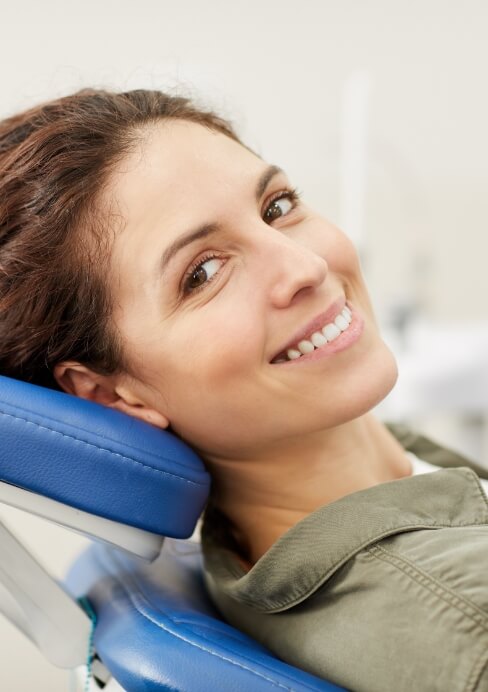 Woman smiling after dental cleaning