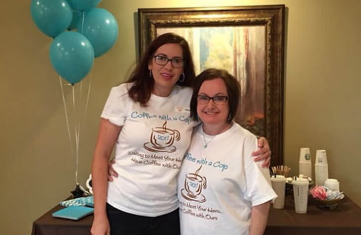 Dental team members wearing coffee with a cop t shirts