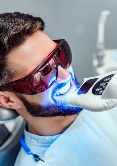 Man receiving professional teeth whitening