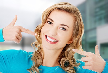 A woman happy with the result of her cosmetic dentistry