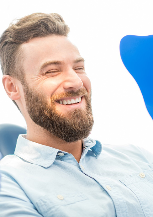 a patient smiling after visiting his cosmetic dentist in Pasadena