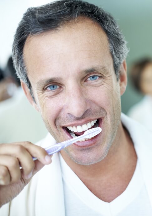 Man brushing teeth