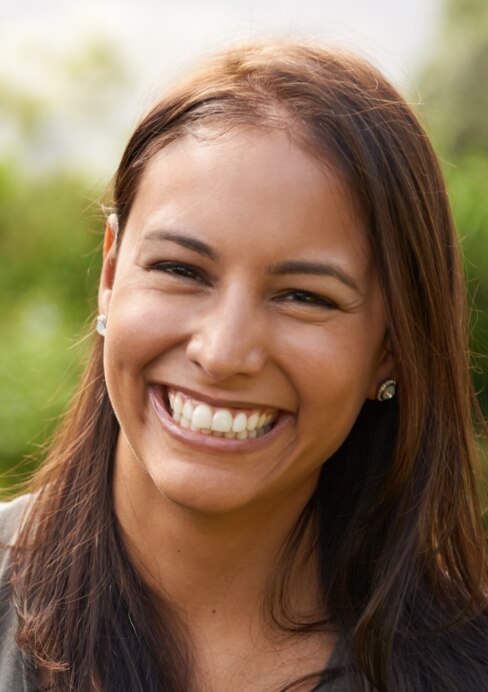 Woman smiling after tooth colored fillings