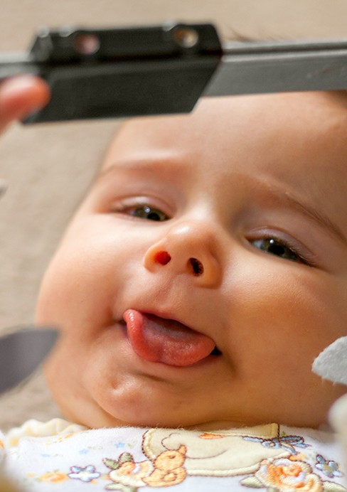 baby smiling and sticking tongue out