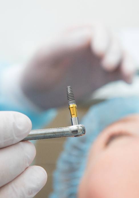 A patient undergoing dental implant surgery