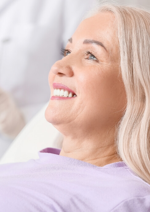 Woman with dental implants smiling