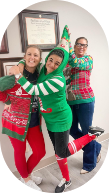 Dental team members in Christmas sweater