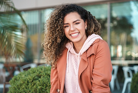 Smiling woman sitting outside