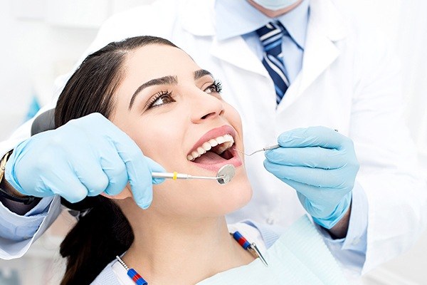 Dentist performing gum disease treatment