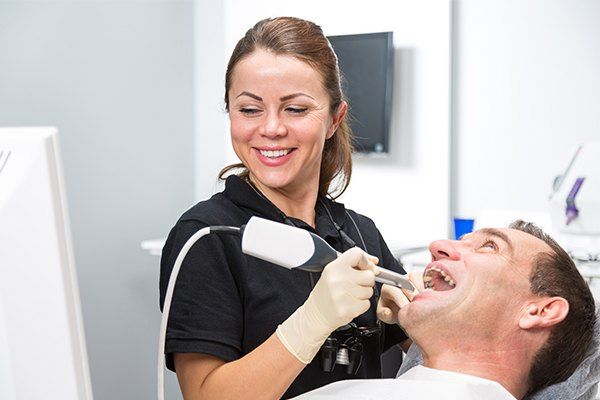 Dentist treating dental patient