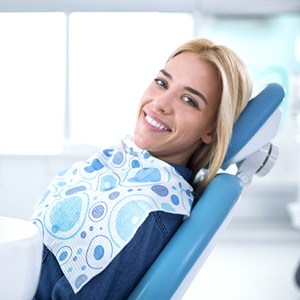 Smiling woman sitting in dental office