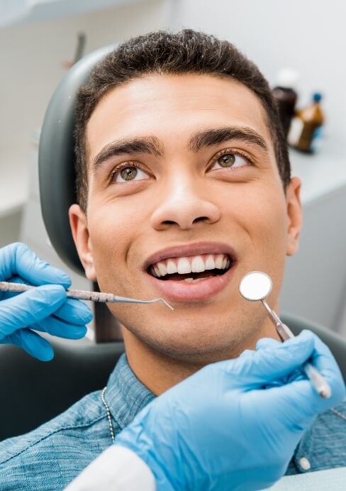 Dental patient receiving an oral cancer screening