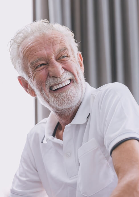 Man sharing smile after full mouth reconstruction