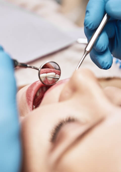 Dental patient receiving oral cancer screening