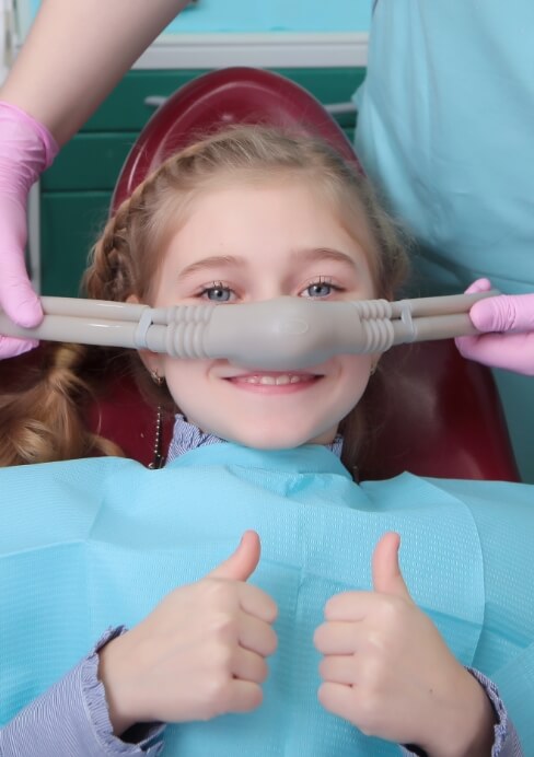 Child receiving nitrous oxide dental sedation