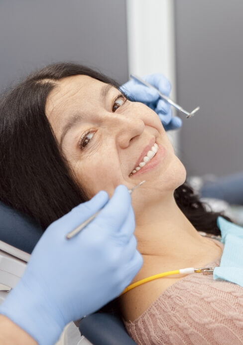 Woman smiling during senior dentistry visit