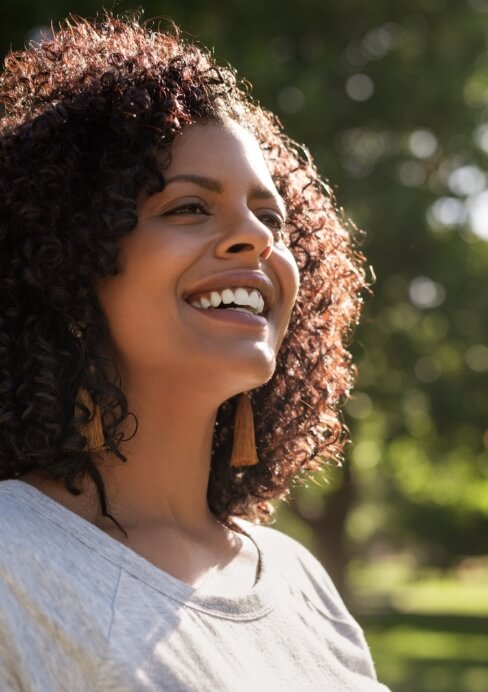 Woman sharing bright smile after teeth whitening