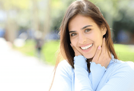 a woman smiling after getting veneers in Pasadena