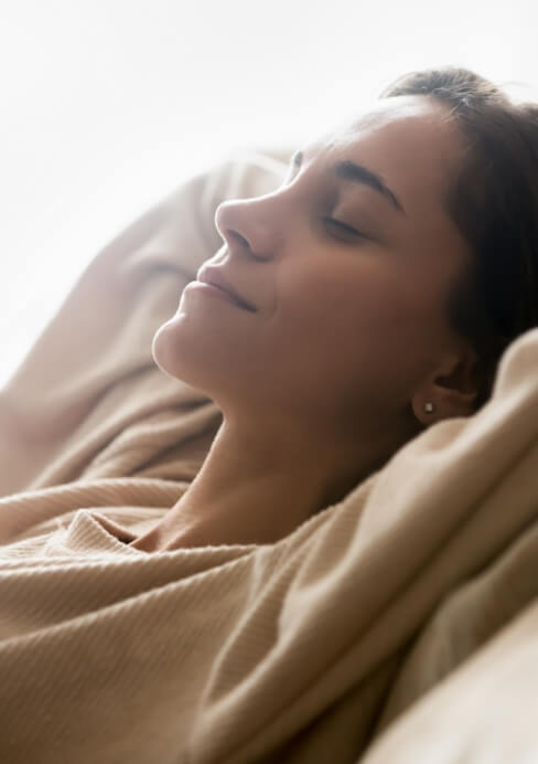 Woman relaxing after wisdom tooth extraction