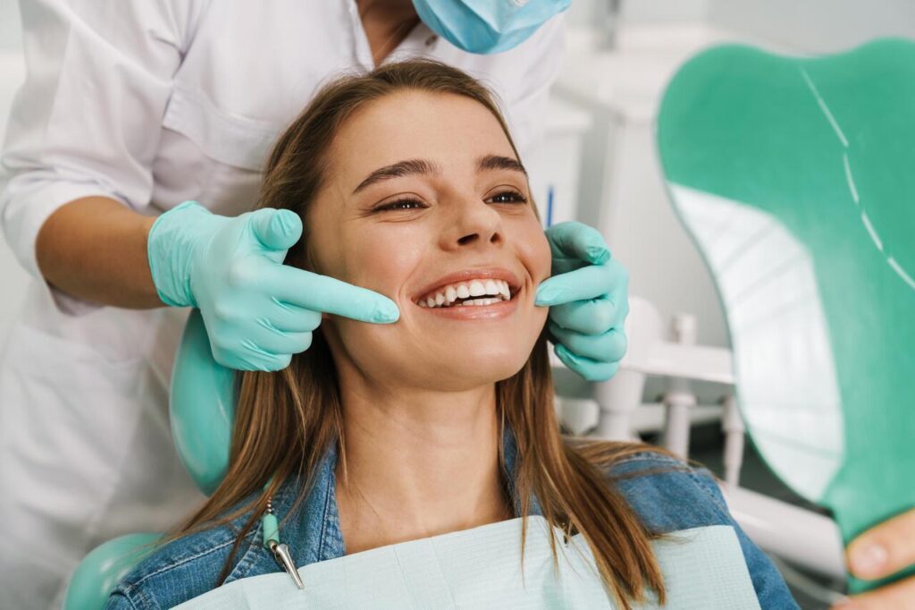 Woman smiling in a dental chair.